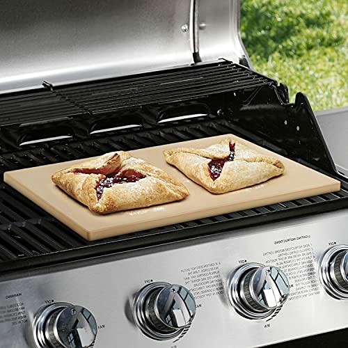 Pastries baking on a grill with a baking stone.